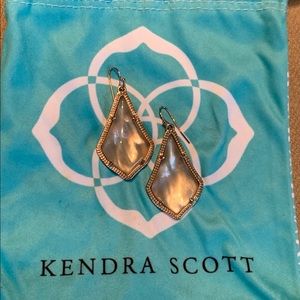 Kendra Scott gold drop earring with pink stone